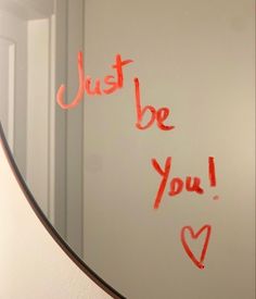 a mirror with writing on it that says just be you