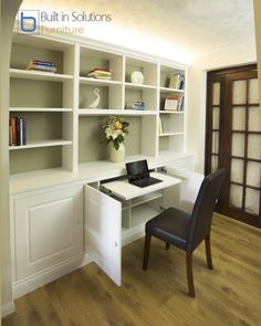 a white desk with a laptop on top of it