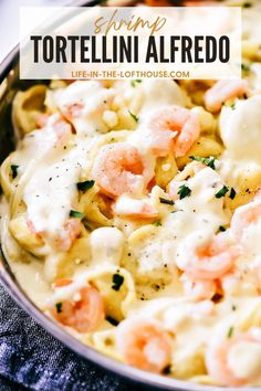 shrimp tortellini alfredo in a skillet with text overlay