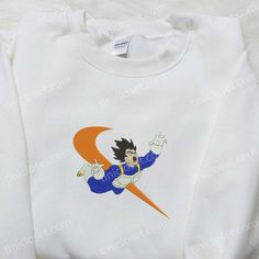 Vegeta x Swoosh Anime Embroidered Hoodie, Cool Anime Clothing, Best Gift Ideas for Family Tinicloset stands as a vibrant and dynamic clothing store that has carved its niche in the fashion industry, offering a captivating array of custom embroidered shirts and a range of other embroidered apparel. At the heart of Tinicloset’s collection lies the... White Hooded Sweatshirt With Character Print, White Fleece Crew Hoodie, White Hoodie With Embroidered Graphics, White Crew Hoodie With Embroidered Graphics, Sporty Cotton Sweatshirt With Character Print, White Embroidered Crew Hoodie, White Embroidered Crew Neck Hoodie, Sporty Hoodie With Character Print, White Sporty Sweatshirt With Cartoon Print