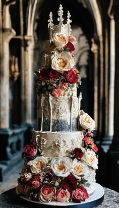 a three tiered wedding cake decorated with flowers