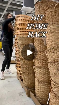 a woman standing next to some baskets in a room with the words diy home hack