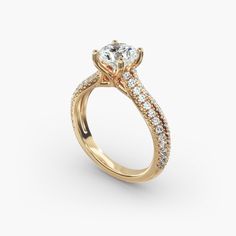 a yellow gold engagement ring with diamonds on the side