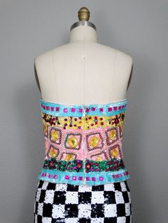 "This is a an absolutely gorgeous vintage embellished strapless top by Julie Duroche - After Five. It's beautifully detailed with multicolored jewels, beads and sequins. It's in excellent condition! Bust - 34\" Waist - 27\" Length - 15\" Tag Size - 10 (fits smaller, please refer to measurements) This item comes from a pet-free and smoke-free home. If you would like more info or have any questions, please don't hesitate to ask!" Strapless Embellished Corset For Party, Glamorous Embellished Strapless Corset, Glamorous Strapless Sequined Corset, Summer Embellished Corset For Night Out, Summer Embellished Fitted Corset, Embellished Fitted Corset For Summer, Embellished Fitted Summer Corset, Strapless Embellished Evening Corset, Embellished Strapless Corset For Wedding