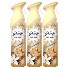 three bottles of deodorant air mist on a white background with snow flakes