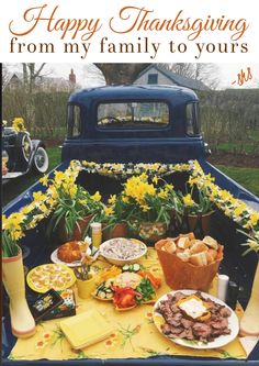 a truck bed with food and flowers in the back