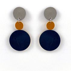 Part of the Polka Dot series, these earrings are a simple graphic, yet classic, statement pieces. They are composed of a string of up-cycled, double-sided leather discs and are ultra light. Dimensions: 1 1/4" x 2 5/8" If you'd like to order a custom pair with specific colors, send us a note! Note: leather is a natural material will have slight variations in color and texture. Iris Jewelry, Clay Jewelry Making, Polka Dot Earrings, Architectural Jewelry, Dot Earrings, Poly Clay, Custom Engagement Rings, Simple Graphic, Handmade Modern