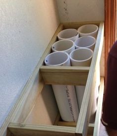 there are many cups in the bottom drawer