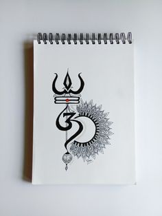 a spiral notebook with an image of the hindu symbol