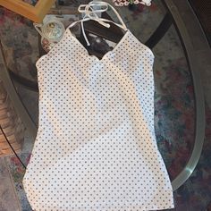 Ivory W/Golden Bronze Metallic Polka Dots. Size Medium. Their Classic Cami/Tank Tops With Built In Shelf Bras For Support. This One Is Halter Style Of Which Just A Few Colors Were Made. Brand New. From Express. White Halter Neck Camisole Casual Style, White Halter Neck Camisole, Chic Tops With Tank Straps For Brunch, White Halter Neck Casual Camisole, Chic Brunch Tops With Tank Straps, White Halter Top With Built-in Bra For Spring, Fitted Cami Halter Top For Day Out, Fitted Summer Tops With Tank Straps, Trendy White Halter Camisole Top