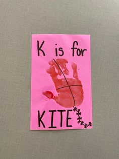 a piece of paper with a handprint on it that says k is for kite