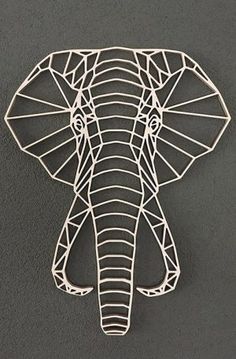 an elephant head made out of wire on a gray background with the word's name below it