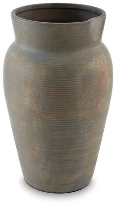 a large brown vase sitting on top of a table