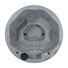 an in - ground hot tub is shown with the lid open and buttons on it