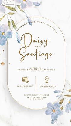 an elegant wedding card with blue flowers and gold foil lettering on the front, in white marble