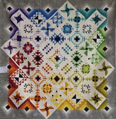 a quilt made with different colors and shapes on the front, side, and back