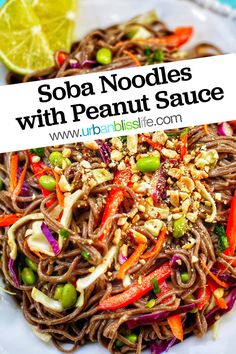 sobba noodles with peanut sauce on a white plate