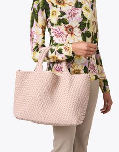 Embrace Naghedi's laid-back elegance with the best-selling St. Barths tote bag. It's expertly woven from neoprene and features a matching pouch that's perfect for toting your everyday essentials. Double Handle Woven Leather Shopping Bag, Woven Leather Shopping Bag With Double Handle, Pink Intrecciato Weave Rectangular Bag, Pink Rectangular Bag With Intrecciato Weave, Pink Woven Leather Bag, Intrecciato Weave Tote Bag For Travel, Woven Leather Tote Bag For Shopping, Travel Bag With Intrecciato Weave And Double Handle, Travel Bag With Double Handle And Intrecciato Weave