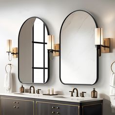 a bathroom with two sinks and mirrors on the wall