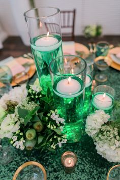 a table with candles and flowers on it