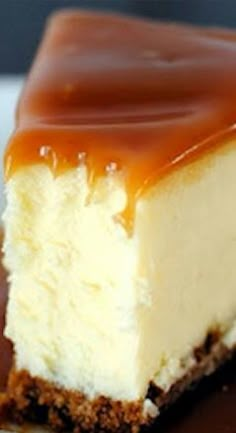 a piece of cheesecake with chocolate sauce on top