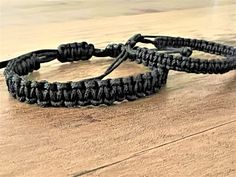 Elevate your style with our handmade black woven thick surf bracelet, perfect for surfers, hippies, and boho lovers. This unisex braided bracelet doubles as a waterproof anklet, making it ideal for water activities. Whether you're shopping for a gift for him or her, this USA seller item is a versatile and trendy choice. Don't miss out on this durable and stylish flat woven bracelet suitable for men and women alike.  Great gifts for your loved ones, for friends, relatives... Bracelet's Info: -App Cheap Black Braided Bracelets For Beach, Casual Black Resizable Braided Bracelets, Handmade Black Braided Bracelets For Beach, Black Woven Braided Bracelets For Gift, Black Waxed Cord Bracelets For Beach, Surf Bracelet, Paracord Bracelet Patterns, Sliding Knot, Anklet Bracelet