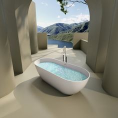 a bathtub with water running down the side and mountains in the backround