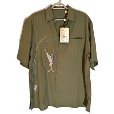 Elevate Your Fishing Wardrobe With This Spicy Tuna Shirt. Featuring An Intricate Marlin And Rod Embroidery On An Olive Green Backdrop, It's Both Stylish And Functional. Measurements Approximate Laying Flat Armpit To Armpit -23” Length Top To Bottom Hem -30” Button-Front Closure Short Sleeves Single Chest Pocket Embroidered Marlin And Fishing Rod Design Olive Green Color Bin21 Size: Mens Size: M Condition: New With Tags Olive Green Backdrop, Mens Fishing Shirts, Spicy Tuna, Green Backdrops, Fish Man, Olive Green Color, Fishing Outfits, Fishing Shirts, Fishing Rod