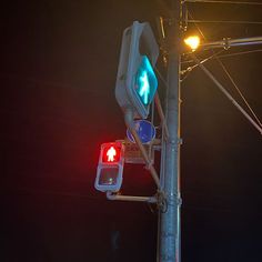 a traffic light that is red and green with an arrow on the left hand side