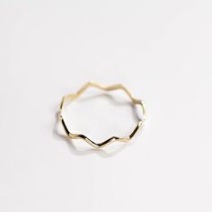 A dainty gold ring with zig zag pattern. A stacking gold ring for women, minimal and simple that adds glam to every outfit. This stacking wavy band can be used a an alternative wedding band as well. The best Christmas gift. 100% handcrafted with love!D E T A I L S● Metal: 14K solid gold, 14K white gold or 14K rose goldR I N G ∙ S I Z I N GFor General Reference:● we use standard US Ring Sizing● an average women's ring finger is size 6-7● each ring is custom made upon order, in any desired size.● Everyday Yellow Gold Wavy Jewelry, Minimalist Yellow Gold Wavy Ring, Minimalist Wavy Yellow Gold Ring, Everyday Wavy Yellow Gold Jewelry, Minimalist 14k Gold Wavy Ring, Gift Wavy Stackable Rings, Gift Stackable Wavy Rings, Gold Wavy Rings For Anniversary, Gold Wavy Promise Ring