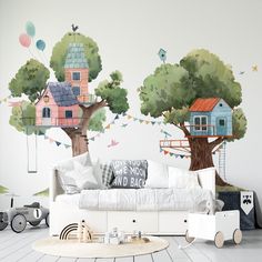 a child's room decorated with trees and houses