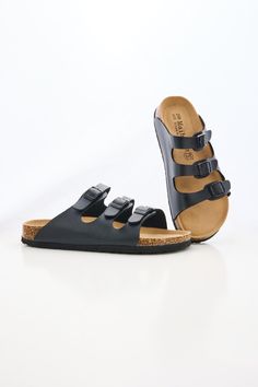 Ready to rock some sandals? Slip into the MAIBULUN Deidra Tri-Strap Footbed Sandal and take your summer style to the next level! These sandals are comfortable, stylish and sure to add a little extra sass to any outfit -- you won't be able to resist showing them off! So buckle up, and let those feet shine! Slip-on / buckle closure Hard Cushioned footbed Man-made leather upper Man-made lining EVA sole Black Slip-on Sandals With Adjustable Strap, Black Double Strap Footbed Sandals With Textured Footbed, Black Flat Sandals With Adjustable Straps, Black Flat Slides With Cork-bed Midsoles, Black Synthetic Footbed Sandals With Adjustable Straps, Black Sandals With Cork-bed Midsoles For Vacation, Black Double Strap Sandals With Textured Footbed, Black Summer Footbed Sandals With Cork-bed Midsoles, Black Beach Sandals With Cork-bed Midsoles