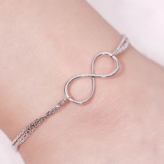 Timeless beauty, endless elegance. This stunning sterling silver anklet turns the classic infinity motif into affordable silver jewelry you can wear everyday. Featuring a infinity along the three layer design chain, this piece of infinity jewelry has a simple style with eye catching appeal. This lovely ankle bracelet makes an excellent anniversary gift for her, or a perfect Valentines Day gift.Weight: 3 gWidth: 2.6 mmHeight: 11.3 mmThickness: 2.2 mmMaterial: Stone Type: Jeulia® StonePlating Colo Elegant Hypoallergenic Infinity Jewelry, Silver Infinity Jewelry, Dainty Infinity Silver Jewelry, Elegant Flexible Anklets As Gift, Dainty Silver Infinity Jewelry, Elegant Flexible Anklets For Gifts, Elegant Hypoallergenic Anklets For Gifts, Silver Flexible Bracelets, Silver Minimalist Flexible Jewelry