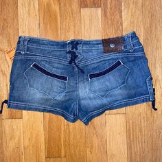 $149 Antik Denim Shorties Denim Lace-Up Western Shorts Size 31 Turquoise Rivets Y2k 98% Lcotton, 2% Spandex - Soft And Stretchy Branded Hardware Polished To High Shine, Set With Faux Blue Turquoise Measurements: Waistband 17.5" Hips 21" Rise 8 1/4" Inseam: 1.5"; Leg Opening: 12 1/2" Y2k Blue Cutoff Bottoms, Y2k Style Blue Cutoff Bottoms, Y2k Short Bottoms With Belt Loops, Y2k Style Short Bottoms With Belt Loops, Y2k Denim Bottoms With Built-in Shorts, Blue Short Jeans With Belt Loops, Y2k Mid-rise Denim Shorts, Blue Y2k Jean Shorts, Y2k Medium Wash Short Bottoms