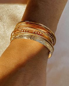 Our most loved Marigold Ring in cuff bracelet form. A bold silhouette meets delicate floral detail. It's truly love at first wear. Wrist Stack, Wrist Stacks, Black Opal Stone, Gold Cuff Bracelet, Black Opal Ring, Stone Feature, Gold Bracelet Cuff, Figaro Chains, Figaro Chain