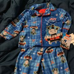 Thomas The Tank Engine “Joy Express” Christmas Pajamas. Pajamas Are Two Pieces. Top Buttons. Blue Cotton Holiday Sleepwear, Blue Cotton Christmas Sleepwear, Blue Bedtime Sets For Winter, Blue Winter Bedtime Sets, Cute Christmas Bedtime Sets, Cute Bedtime Christmas Sets, Cute Bedtime Sets For Christmas, Holiday Bedtime Sets With Long Sleeves, Playful Christmas Playtime Clothing Sets