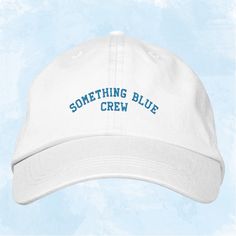 Celebrate your "Something Blue Crew" in style with this chic and modern baseball cap! Perfect for bridal party events, bachelorette weekends, or as a thoughtful gift for your wedding squad, this hat adds a fun and coordinated touch to your celebrations. Featuring a sleek design with "Something Blue Crew" embroidered in bold lettering, this cap is both fashionable and functional. Whether you're planning a beach bachelorette or a casual bridal shower, this accessory is a versatile addition to your Blue Hat With Letter Print And Curved Brim, Adjustable Hats With Letter Print For Graduation, Customizable Blue Snapback Baseball Cap, Customizable Blue Hats One Size Fits Most, Customizable Blue Hats One Size, Customizable Blue Baseball Cap With Curved Brim, Blue Hat With Letter Print And Curved Bill, Something Blue Crew, Wedding Squad