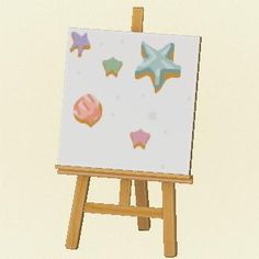 an easel with a painting on it that has starfishs and seashells painted on it