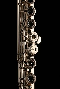 a close up of a musical instrument on a black background