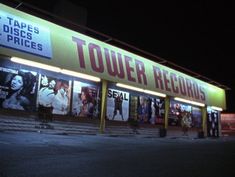 the outside of a movie theater at night