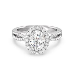 a diamond engagement ring with an oval center surrounded by pave diamonds