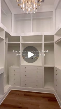 an empty walk in closet with chandelier hanging from the ceiling