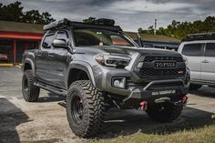 a gray toyota truck parked in a parking lot