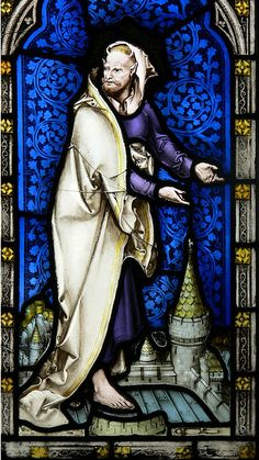 a stained glass window with a man holding something