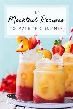 three mason jars filled with lemonade and strawberries on top of a white plate