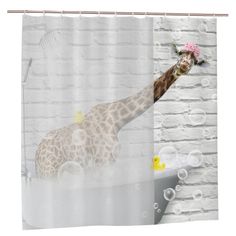 a shower curtain with a giraffe in the bathtub