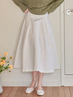 Editor's NotesThis can create a lovely mood with a long length and flared skirt. Especially, if you wear it with a tweed jacket, you can create a feminine silhouette.- Deep and wide crease detail- Relaxed fit- 2 Colors: Ivory, Beige*Product image color may differ slightly from actual color depending on the resolution of your monitor.Measurements (inch)S / M - Waist: 12.40 in. / 13.19 in.- Hip: 17.72 in. / 18.50 in.- Hem: 19.69 in. / 20.08 in.- Length: 23.62 in. / 24.02 in.*Model size: Height 5'64 (wearing S size)*There may be a difference of 0.4 in. to 1.18 in. depending on where the size is measured.Composition & Care- 65% Cotton, 28% Rayon, 7% Nylon- Dry cleaning recommended for first wash- In order to maintain the unique fit and color of denim for a long time, please avoid frequent White A-line Skirt For Fall, Classic A-line Skirt For Daywear, Elegant A-line Pleated Skirt For Daywear, Chic Cotton A-line Pleated Skirt, Elegant A-line Cotton Skirt, Elegant Cotton A-line Pleated Skirt, Elegant Cotton Skirt, Relaxed Fit Skirt With Wide Hem For Spring, Relaxed Spring Skirt With Wide Hem