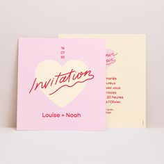 a pink card with the word congratulations written in red on it and a white heart