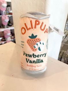 a can of strawberry vanilla sitting on top of a counter