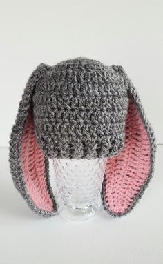 a crocheted hat with ears is shown